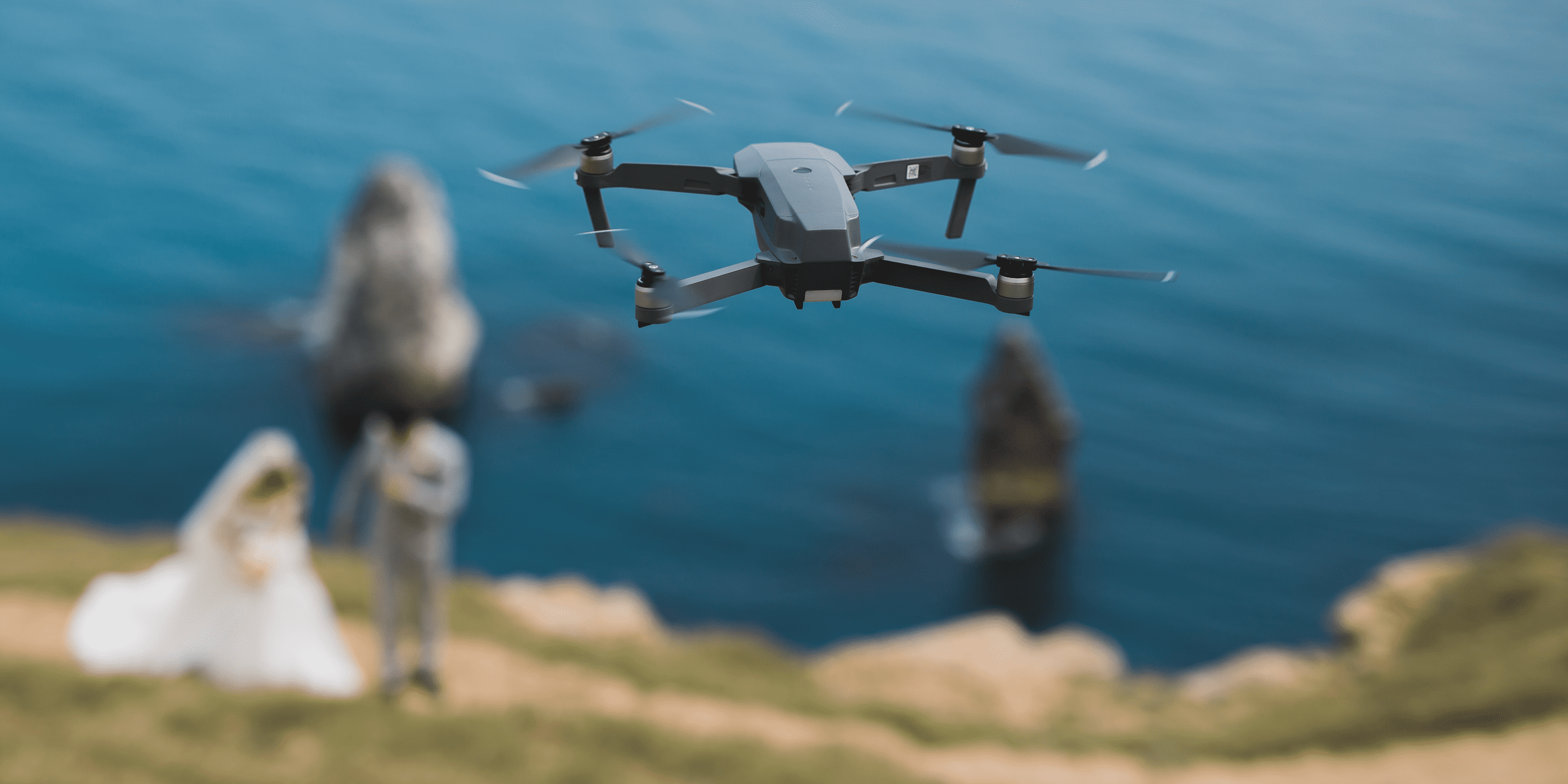 drone taking pictures of wedding couple in nature