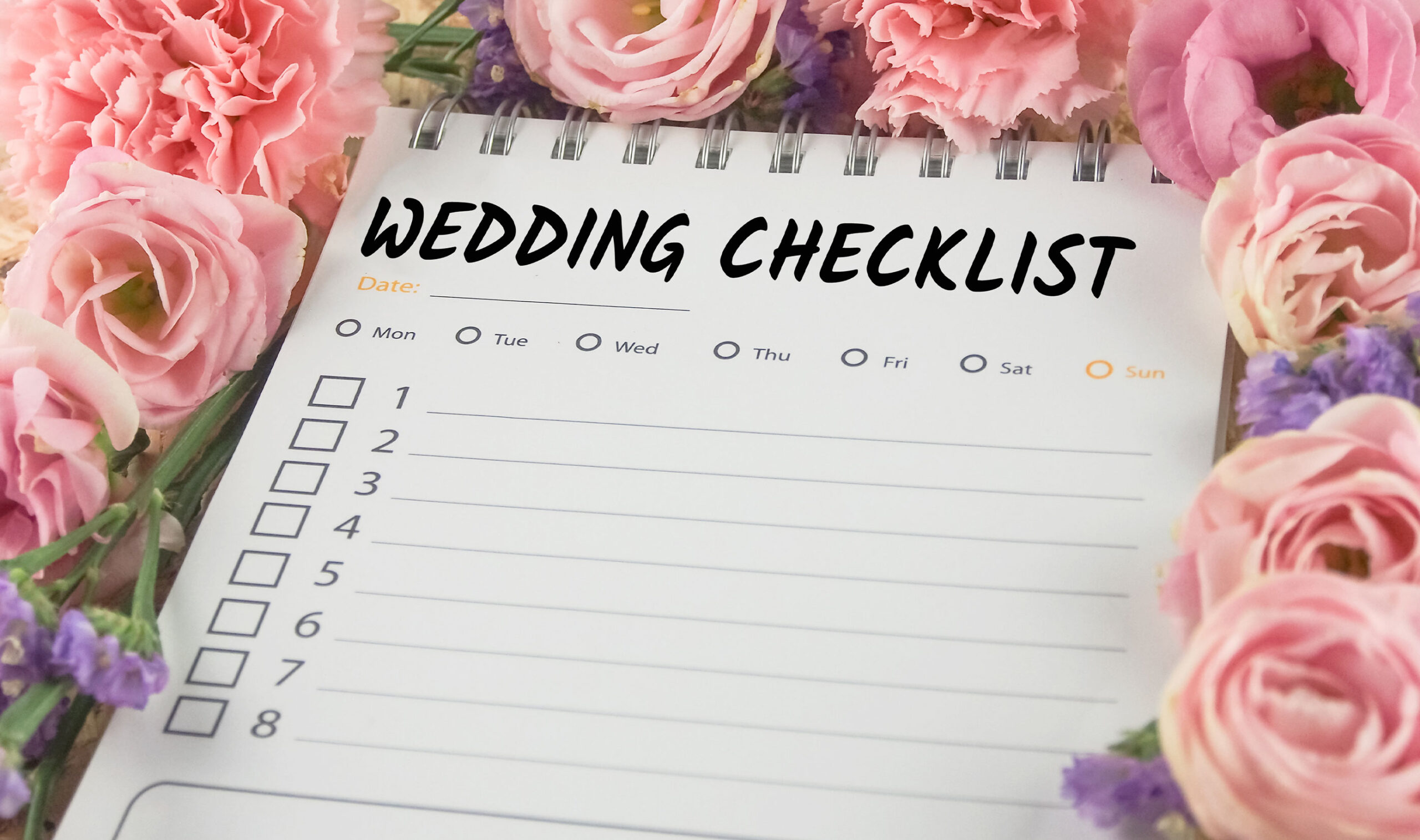 word wedding checklist note paper on pink flower background